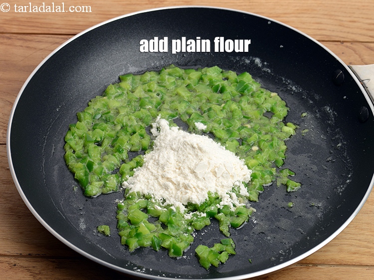 Step 6 – Add 1 tbsp&nbsp;<a href="https://www.tarladalal.com/glossary-plain-flour-maida-188i">plain flour (maida)</a>.&nbsp;&nbsp;