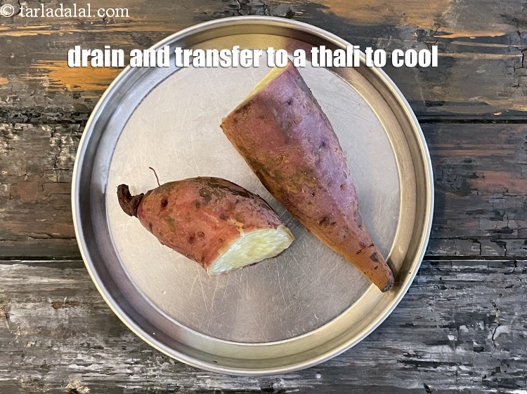 Step 6 – Transfer the sweet potatoes to a thali or plate to cool.