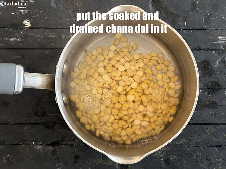 Step 7 – Put the soaked and drained chana dal in it.