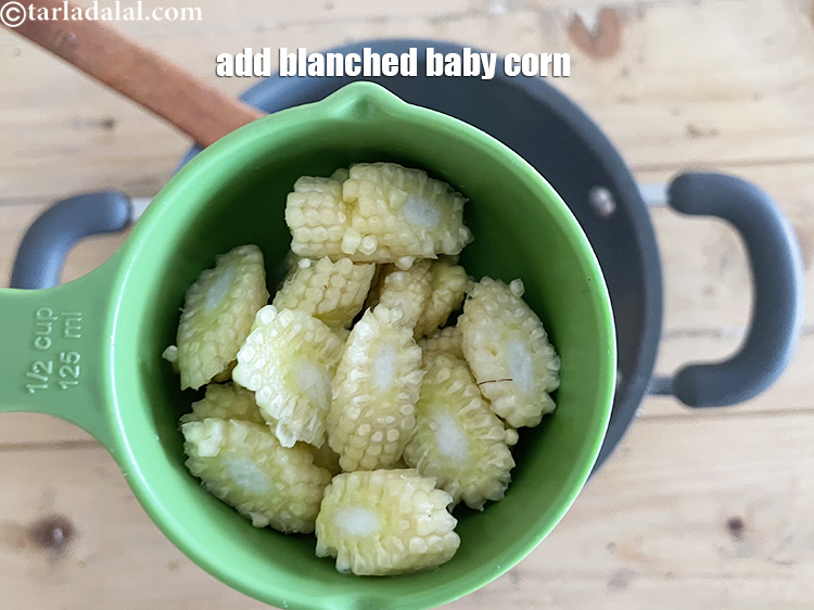 Step 9 – Add&nbsp;<meta charset="UTF-8" />1/2 cup&nbsp;<a href="glossary-diagonally-cut-and-blanched-baby-corn-2308i">diagonally cut and blanched babycorn</a>.
