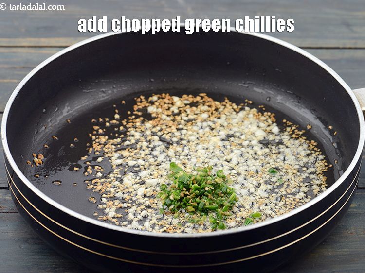 Step 16 – Add 2 tsp&nbsp;finely&nbsp;<a href="https://www.tarladalal.com/glossary-chopped-green-chilli-820i">chopped green chillies</a>.&nbsp;