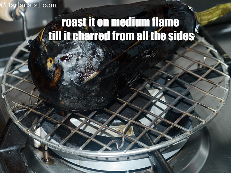 Step 6 – Roast it on a medium flame till it charred from all the sides.&nbsp;Keep rotating so …
