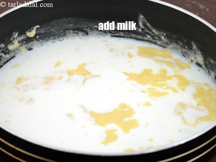 Step 6 – Add &frac12; cup <a href="https://www.tarladalal.com/glossary-milk-doodh-full-cream-milk-514i">milk</a>.