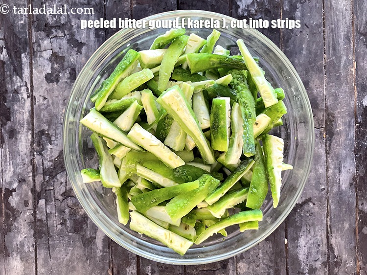 Step 6 – <meta charset="UTF-8" />To make&nbsp;karela bateta nu shaak, put&nbsp;<meta charset="UTF-8" />3 cups&nbsp;<a href="glossary-bitter-gourd-karela-214i">bitter gourd (karela)</a>&nbsp;, peeled …