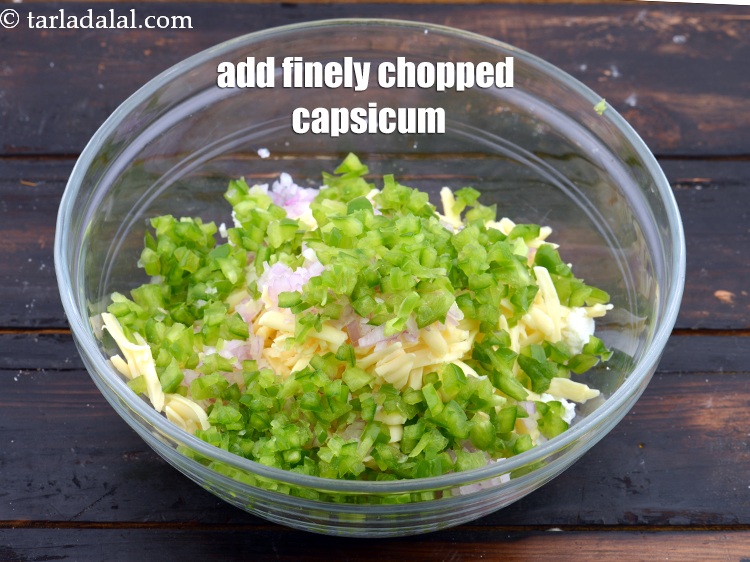 Step 6 – Add 1/2 cup&nbsp;finely&nbsp;<a href="https://www.tarladalal.com/glossary-chopped-capsicum-164i">chopped capsicum</a>.