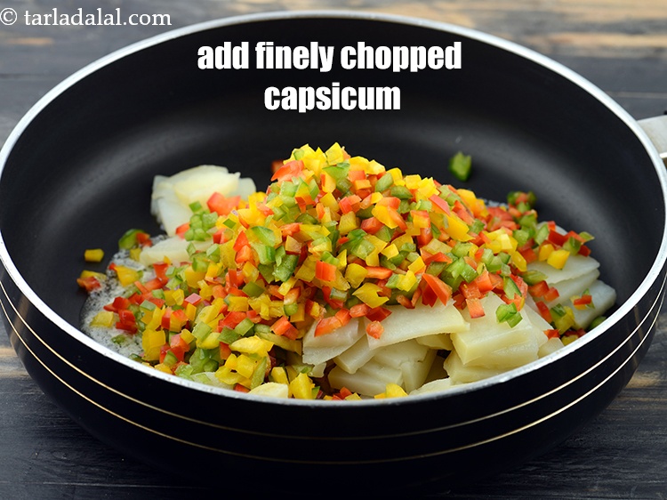 Step 6 – Add 3/4 cup&nbsp;finely&nbsp;<a href="https://www.tarladalal.com/glossary-chopped-capsicum-164i">chopped coloured capsicum</a>.