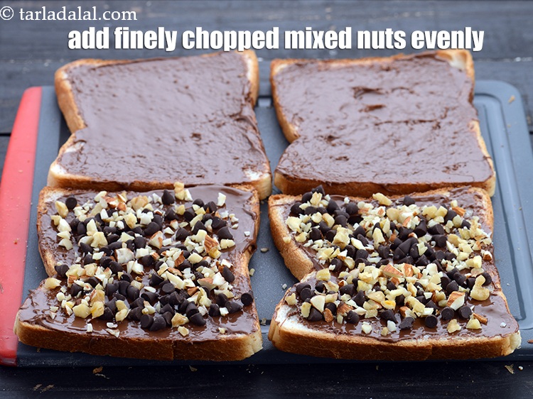 Step 6 – Add 1 tbsp&nbsp;finely&nbsp;<a href="https://www.tarladalal.com/glossary-chopped-mixed-nuts-928i">chopped mixed nuts</a> evenly over 2 slices.