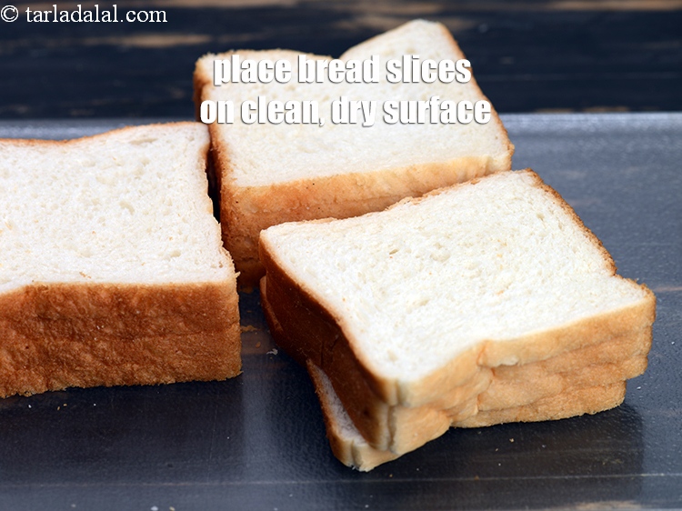 Step 6 – Place the <a href="https://www.tarladalal.com/glossary-bread-219i">bread</a>&nbsp;slices on a clean, dry surface.