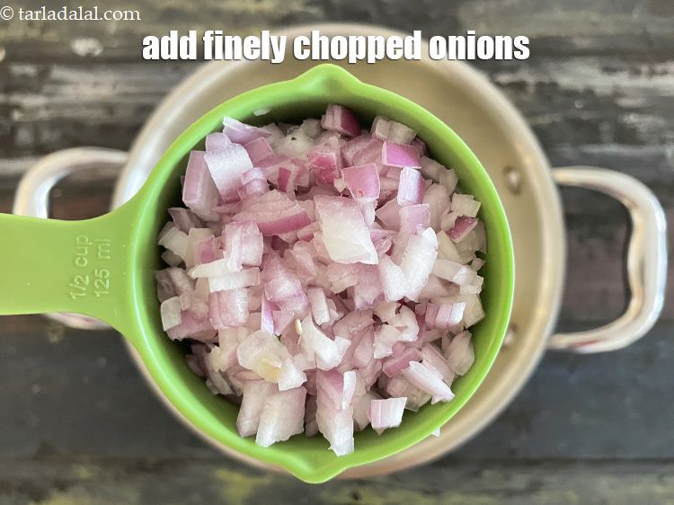 Step 8 – Add&nbsp;1/2 cup&nbsp;finely&nbsp;<a href="https://tarladalal.com/glossary-chopped-onions-722i">chopped onions</a>.