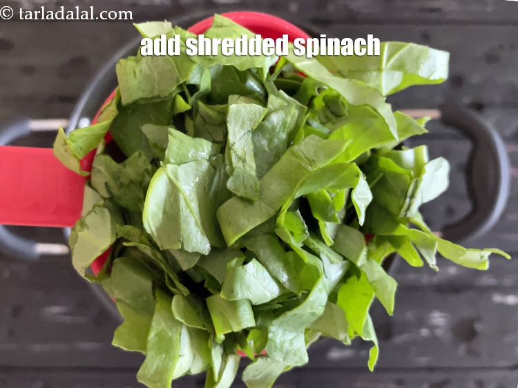 Step 12 – Add&nbsp;<meta charset="UTF-8" />2 cups&nbsp;<a href="glossary-shredded-spinach-777i">shredded spinach (palak) leaves</a>.