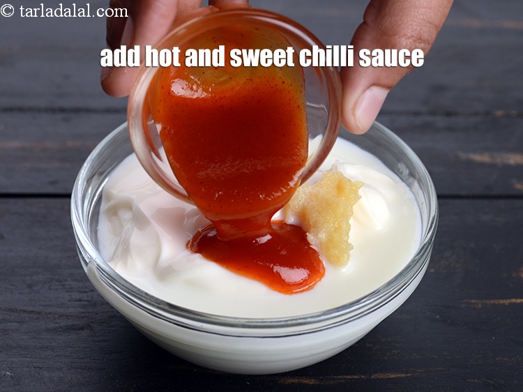 Step 7 – Add 2 tsp <a href="https://www.tarladalal.com/glossary-hot-and-sweet-chilli-sauce-1600i">hot and sweet chilli sauce</a>.