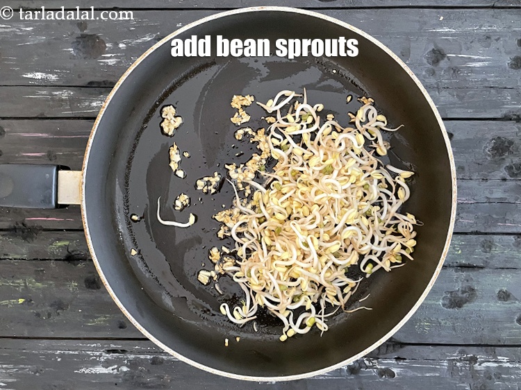 Step 15 – Add&nbsp;<meta charset="UTF-8" />1 cup&nbsp;<a href="glossary-bean-sprouts-193i">bean sprouts</a>.