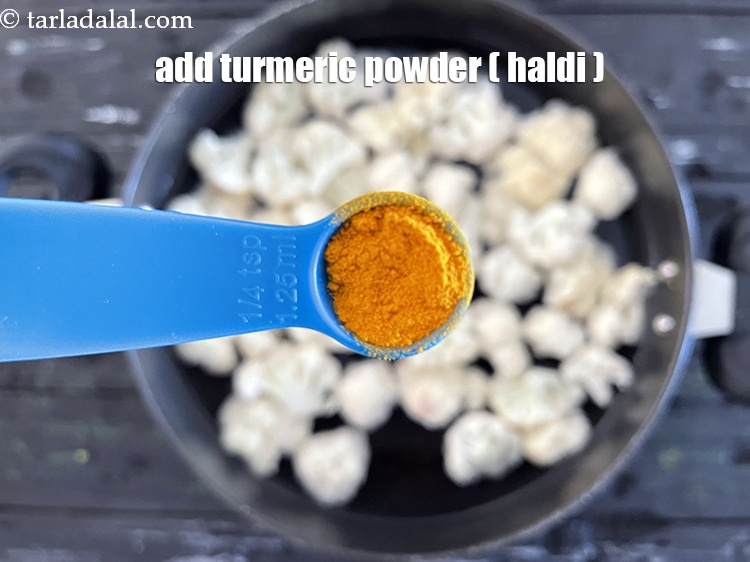 Step 6 – Add 1/4 tsp&nbsp;<a href="glossary-turmeric-powder-haldi-645i">turmeric powder (haldi)</a>.