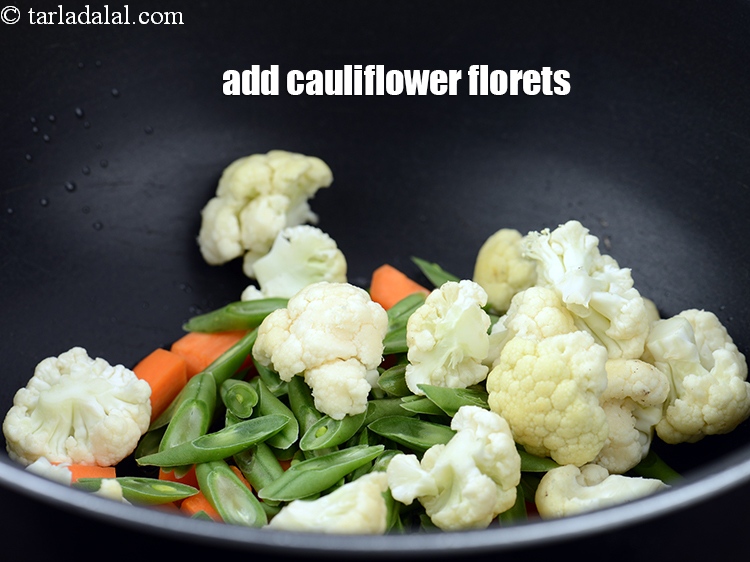 Step 7 – Add 1 cup&nbsp;<a href="https://www.tarladalal.com/glossary-cauliflower-florets-753i">cauliflower florets</a>.
