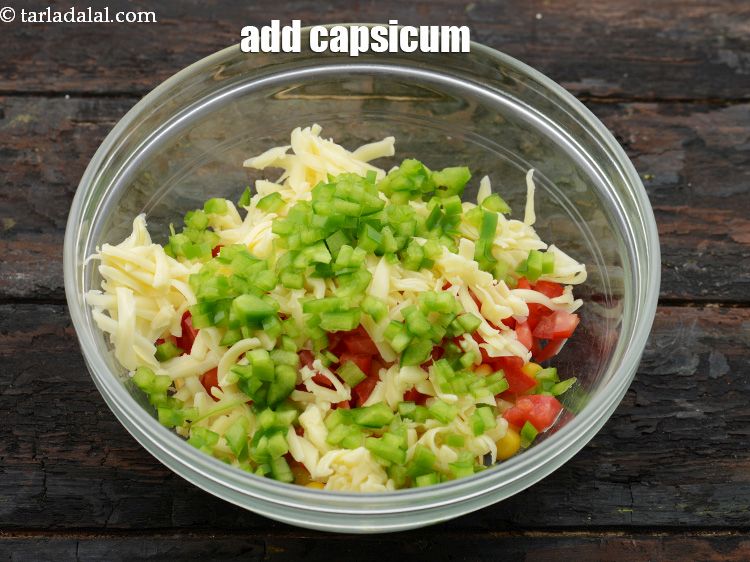 Step 6 – Add&nbsp;1/4 cup&nbsp;finely&nbsp;<a href="https://www.tarladalal.com/glossary-chopped-capsicum-164i">chopped capsicum</a>.&nbsp;