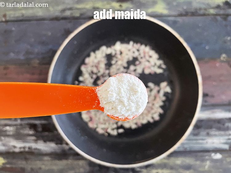 Step 13 – Add&nbsp;2 tsp&nbsp;<a href="glossary-plain-flour-maida-188i">plain flour (maida)</a>.