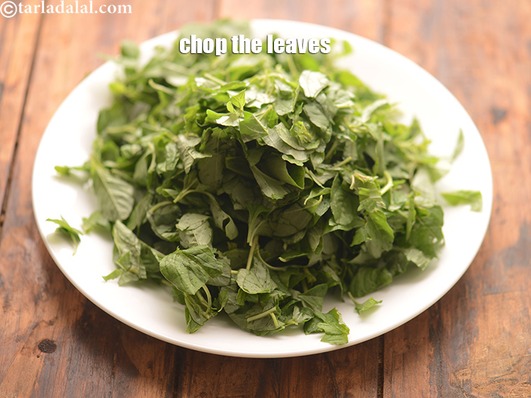 Step 15 – Take a few leaves and chop them with a sharp knife on the chopping board.&nbsp;