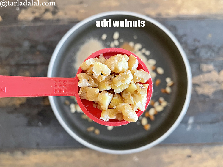 Step 27 – Add&nbsp;2 tbsp&nbsp;<a href="https://www.tarladalal.com/glossary-chopped-walnuts-785i">chopped walnuts</a>.