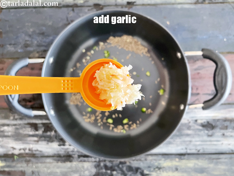 Step 18 – Add&nbsp;<meta charset="UTF-8" />2 tsp&nbsp;finely&nbsp;<a href="glossary-chopped-garlic-790i">chopped garlic (lehsun)</a>.