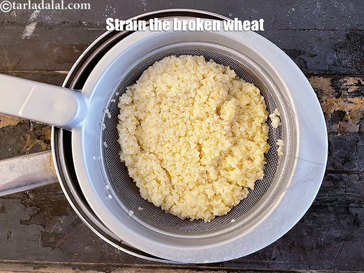 Step 7 – Once cooked, strain the dalia.