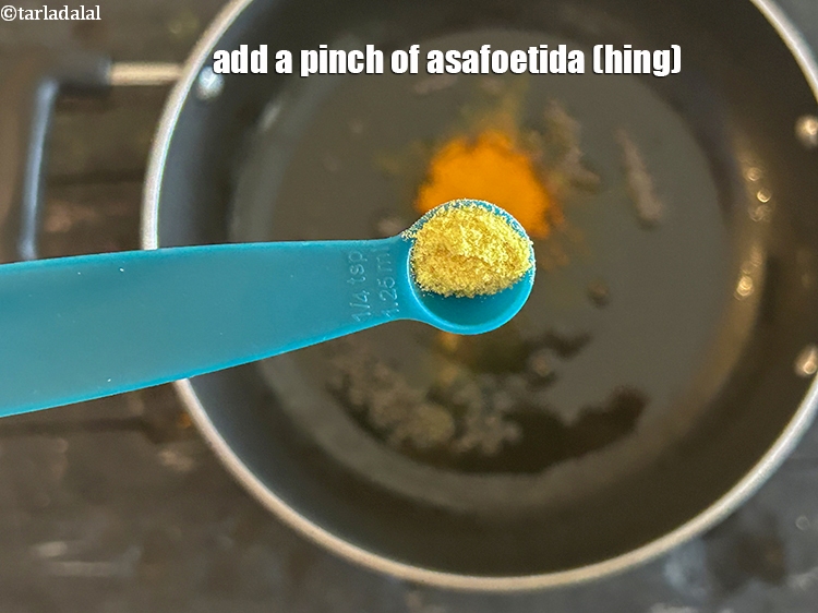 Step 8 – Add&nbsp;<meta charset="UTF-8" />a pinch of&nbsp;<a href="glossary-asafoetida-hing-113i">asafoetida (hing)</a>.