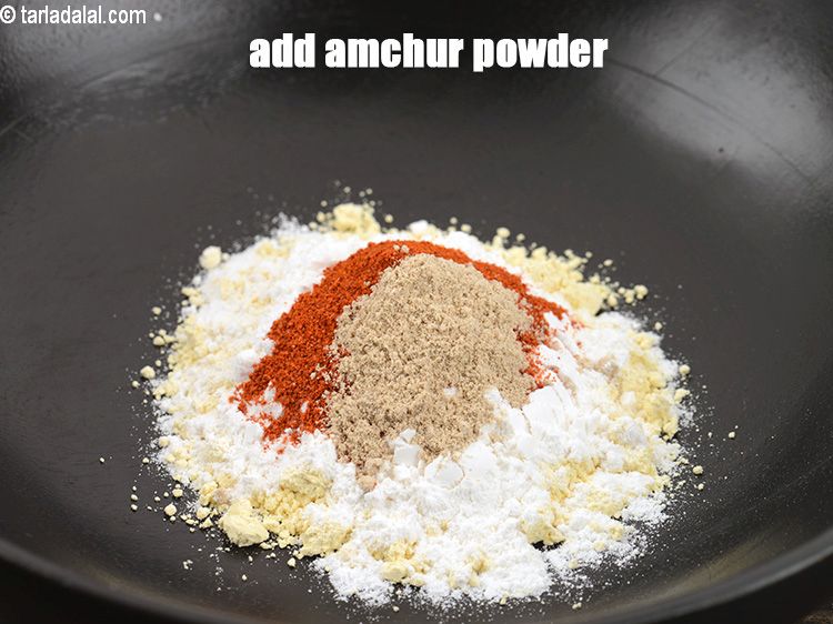 Step 34 – Add &frac12; tsp amchur powder.