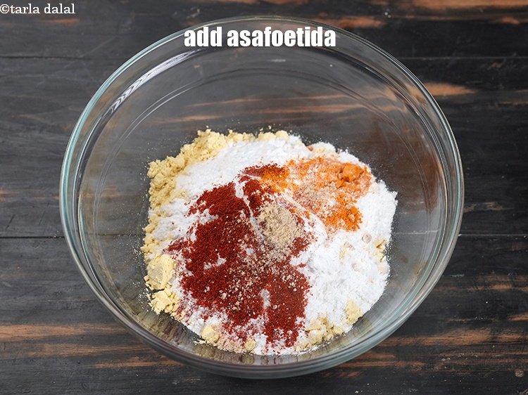 Step 7 – Add 1/4 tsp <a href="https://www.tarladalal.com/glossary-asafoetida-hing-113i">asafoetida (hing)</a>.