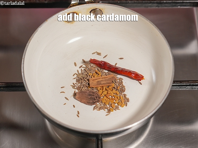 Step 7 – Add 1 <a href="https://www.tarladalal.com/glossary-black-cardamom-badi-elaichi-moti-elaichi-263i">black cardamom (badi elaichi)</a>.