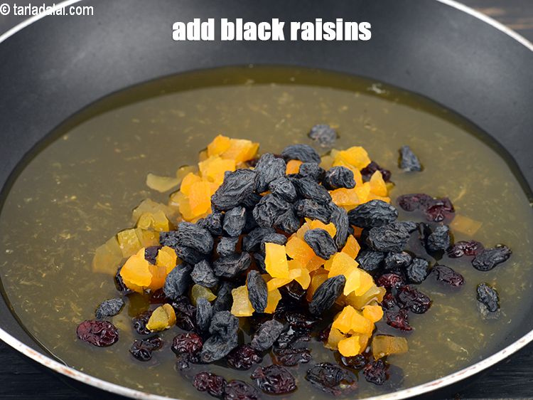 Step 8 – Add 2 tbsp <a href="https://www.tarladalal.com/glossary-black-raisins-kali-kismis-kali-kishmish-600i">black raisins</a>.
