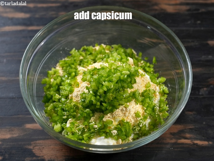 Step 7 – Add 1/2 cup finely&nbsp;<a href="https://www.tarladalal.com/glossary-chopped-capsicum-164i">chopped capsicum</a>.