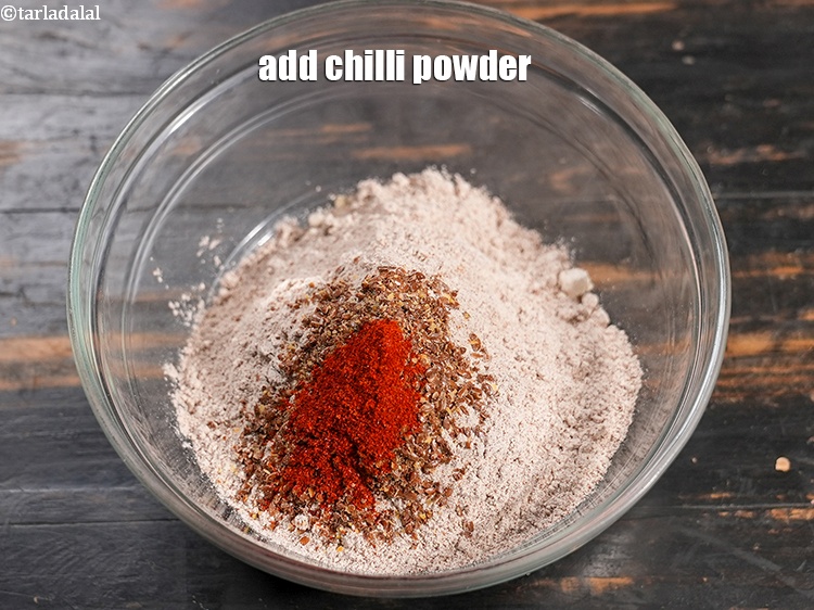 Step 7 – Add &frac12; tsp <a href="https://www.tarladalal.com/glossary-chilli-powder-red-chilli-powder-339i">chilli powder</a>.