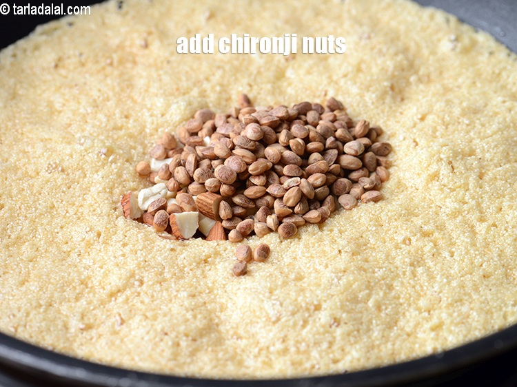 Step 7 – Add 1 tbsp <a href="https://www.tarladalal.com/glossary-chirongi-nuts-charoli-piyal-seeds-305i">chironji nuts</a>.&nbsp;