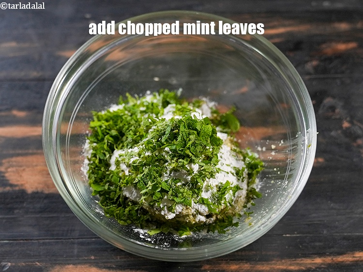 Step 7 – Add 2 tbsp finely <a href="https://www.tarladalal.com/glossary-chopped-mint-788i">chopped mint leaves (phudina)</a>.