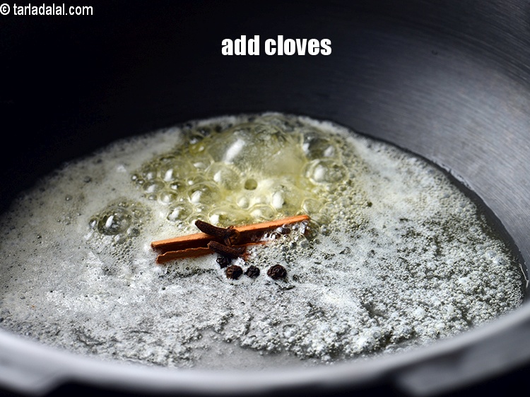 Step 7 – Add 2&nbsp;<a href="https://www.tarladalal.com/glossary-cloves-laung-lavang-322i">cloves (laung / lavang)</a>.&nbsp;