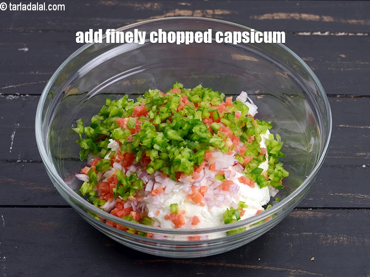 Step 7 – Add 3 tbsp finely <a href="https://www.tarladalal.com/glossary-chopped-capsicum-164i">chopped capsicum</a>.