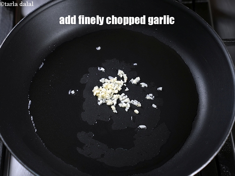 Step 7 – Add 1 tsp finely <a href="https://www.tarladalal.com/glossary-chopped-garlic-790i">chopped garlic (lehsun)</a>.