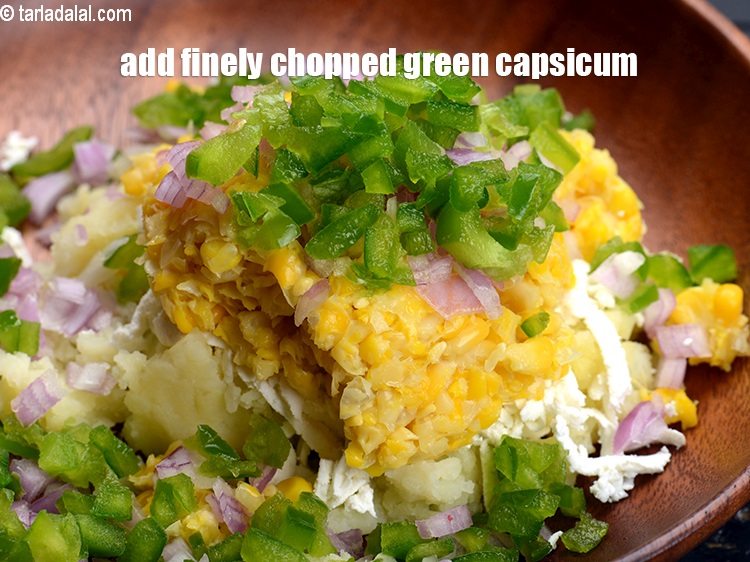 Step 7 – Add &frac14; cup finely chopped green <a href="https://www.tarladalal.com/glossary-capsicum-shimla-mirch-bell-pepper-163i">capsicum</a>.