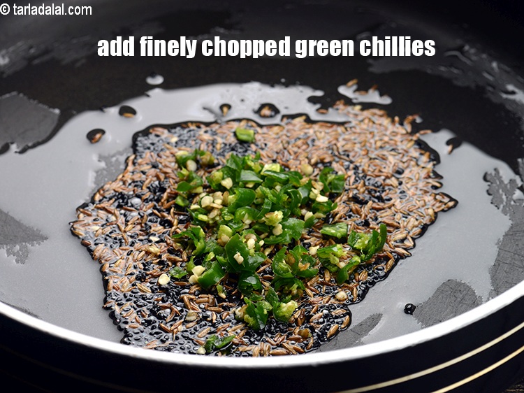 Step 7 – Add 1 tbsp finely <a href="https://tarladalal.com/glossary-chopped-green-chilli-820i">chopped green chillies</a>.&nbsp;