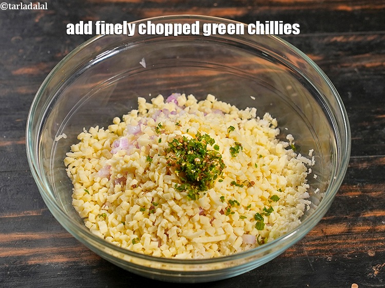 Step 7 – Add 1 tsp finely <a href="https://www.tarladalal.com/glossary-chopped-green-chilli-820i">chopped green chillies</a>.