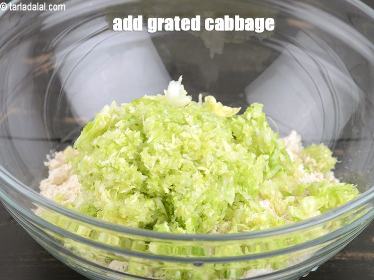 Step 7 – Add 3/4 cup <a href="https://www.tarladalal.com/glossary-grated-cabbage-860i">grated cabbage</a>.