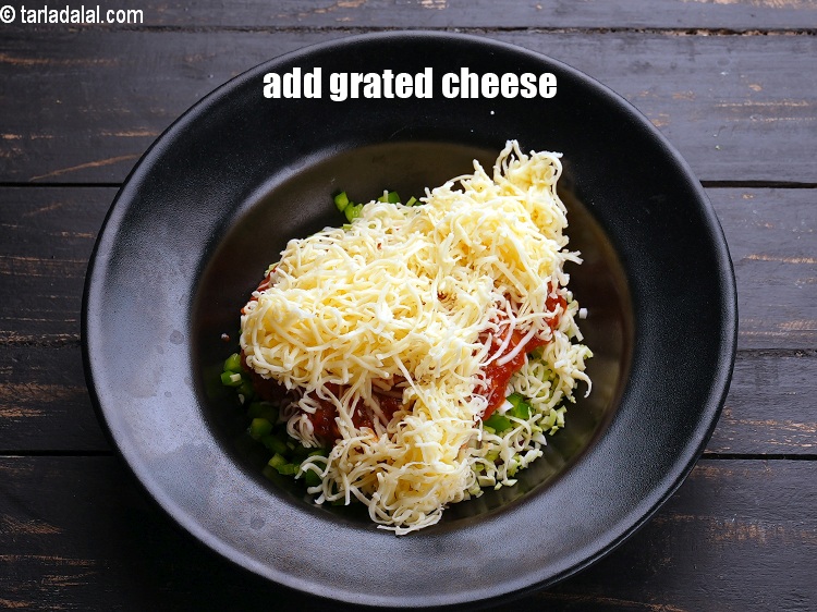 Step 7 – Add &frac12; cup <a href="https://www.tarladalal.com/glossary-grated-processed-cheese-868i">grated processed cheese</a>.