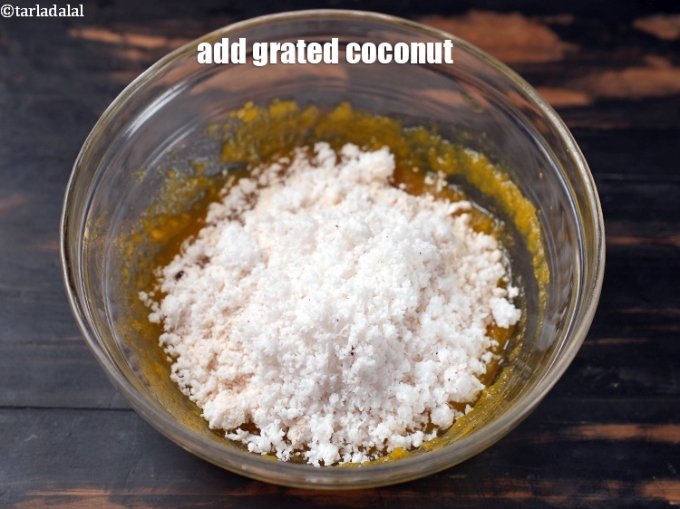 Step 7 – Add 1/2 cup freshly <a href="https://www.tarladalal.com/glossary-grated-coconut-852i">grated coconut</a>.