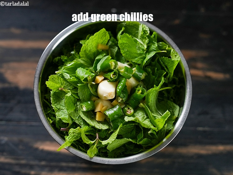 Step 7 – Add 2&nbsp;<a href="https://www.tarladalal.com/glossary-green-chillies-hari-mirch-331i">green chillies</a>, roughly chopped.