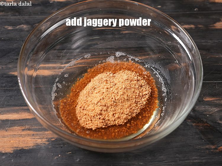 Step 7 – Add &frac12; cup<a href="https://www.tarladalal.com/glossary-jaggery-powder-2815i" target="_blank"> jaggery powder</a>.