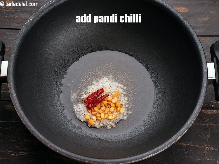 Step 7 – Add 1 dry pandi chilli, broken into peices.