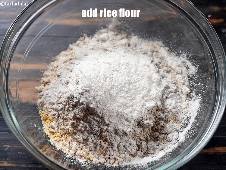 Step 7 – Add 1/4 cup <a href="https://www.tarladalal.com/glossary-rice-flour-chawal-ka-atta-534i">rice flour (chawal ka atta)</a>.