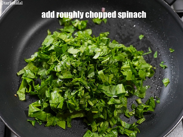 Step 7 – Add 2 cups roughly <a href="https://www.tarladalal.com/glossary-chopped-spinach-780i">chopped spinach (palak)</a>.