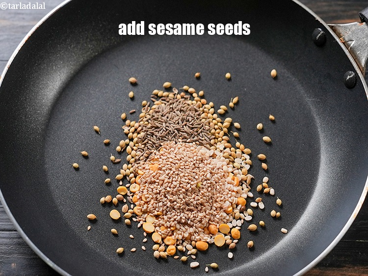 Step 7 – Add 1/2 tbsp <a href="https://www.tarladalal.com/glossary-sesame-seeds-til-gingelly-seeds-612i">sesame seeds (til)</a>.