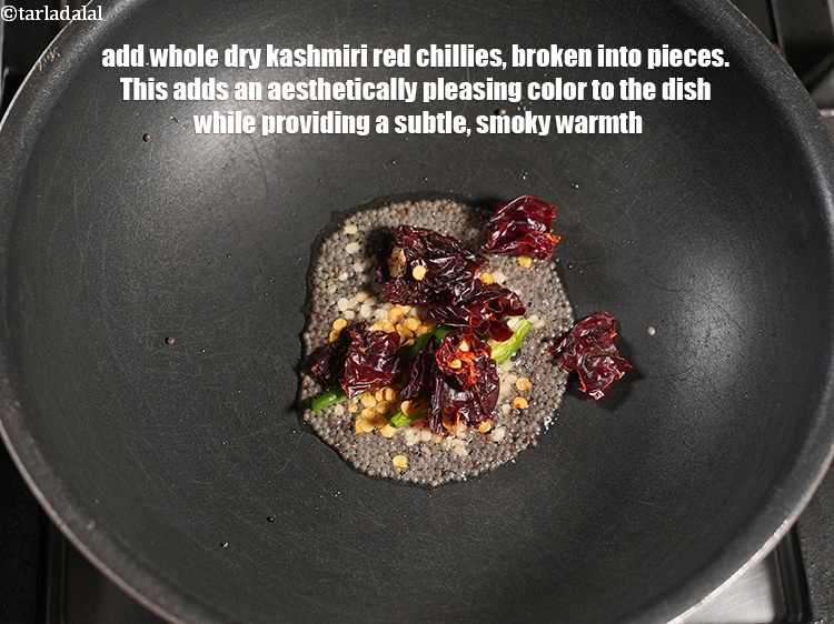 Step 7 – Add 2 <a href="https://www.tarladalal.com/glossary-whole-dry-kashmiri-red-chillies-kashmiri-mirch-kashmiri-lal-mirch-332i">whole dry kashmiri red chillies</a>, broken into pieces. This adds an aesthetically …
