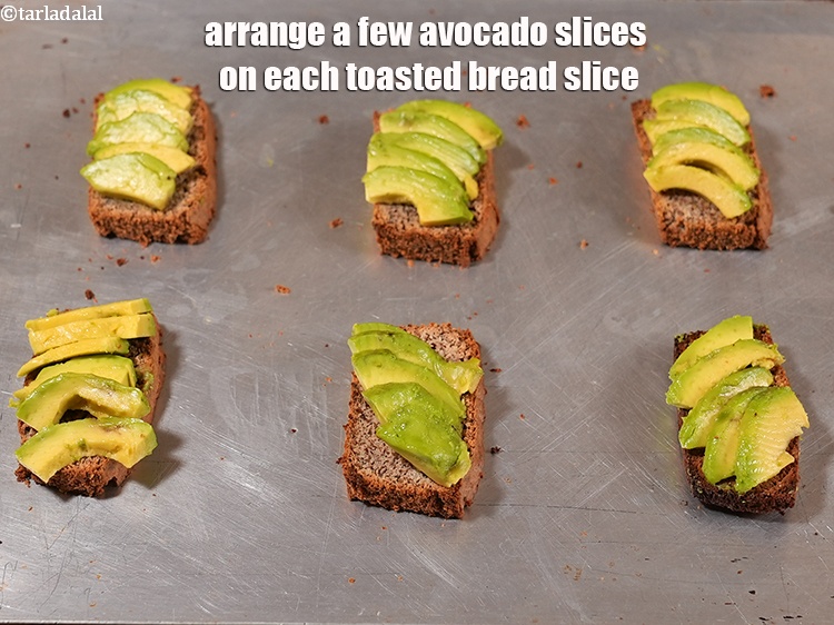 Step 9 – Arrange a few&nbsp;avocado slices on each toasted bread slice.